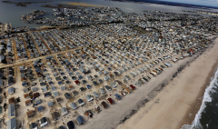 Homes are surrounded by sand washed in by Superstorm Sandy in Seaside Heights, New Jersey. (Mario Tama/Getty Images)